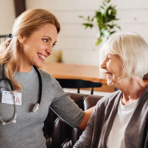 nurse talking to elderly patient