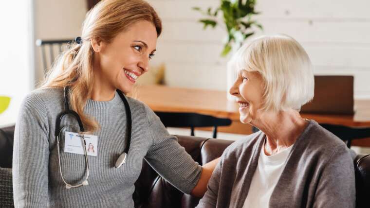 nurse talking to elderly patient